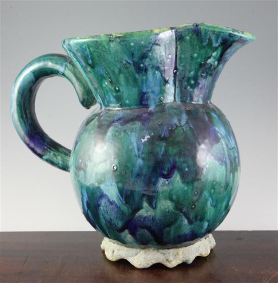 Kate Malone. A green and blue mottled glazed ewer, 36cm